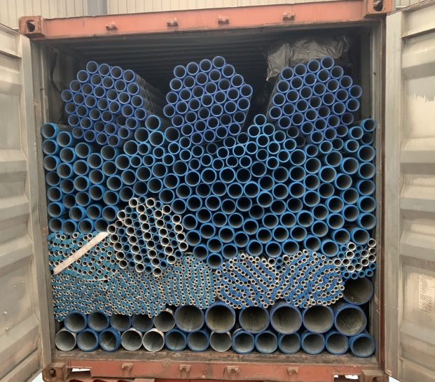 Container loading - Blue coated pipes